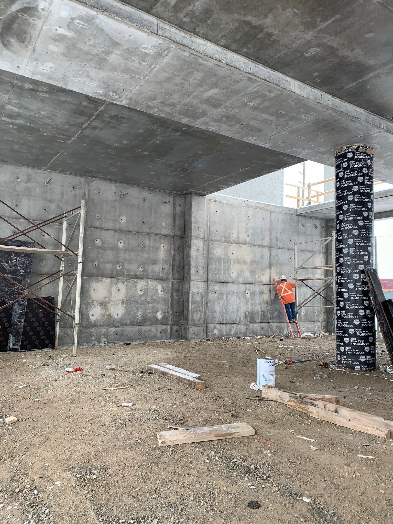 The underside of a suspended concrete slab above freshly formed walls and columns